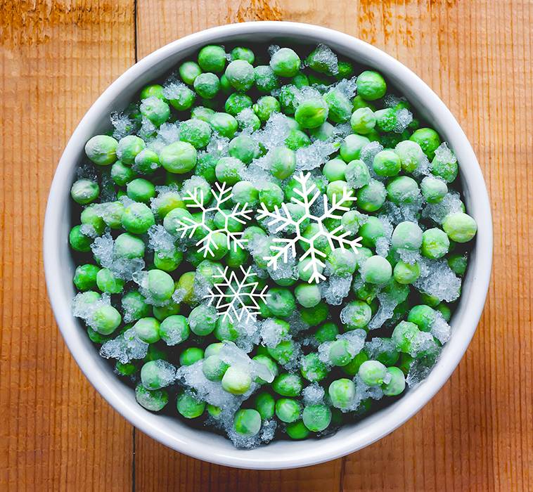 A porcelain bowl with frozen green peas, with 3 icicle icons on top to highlight the frozen state